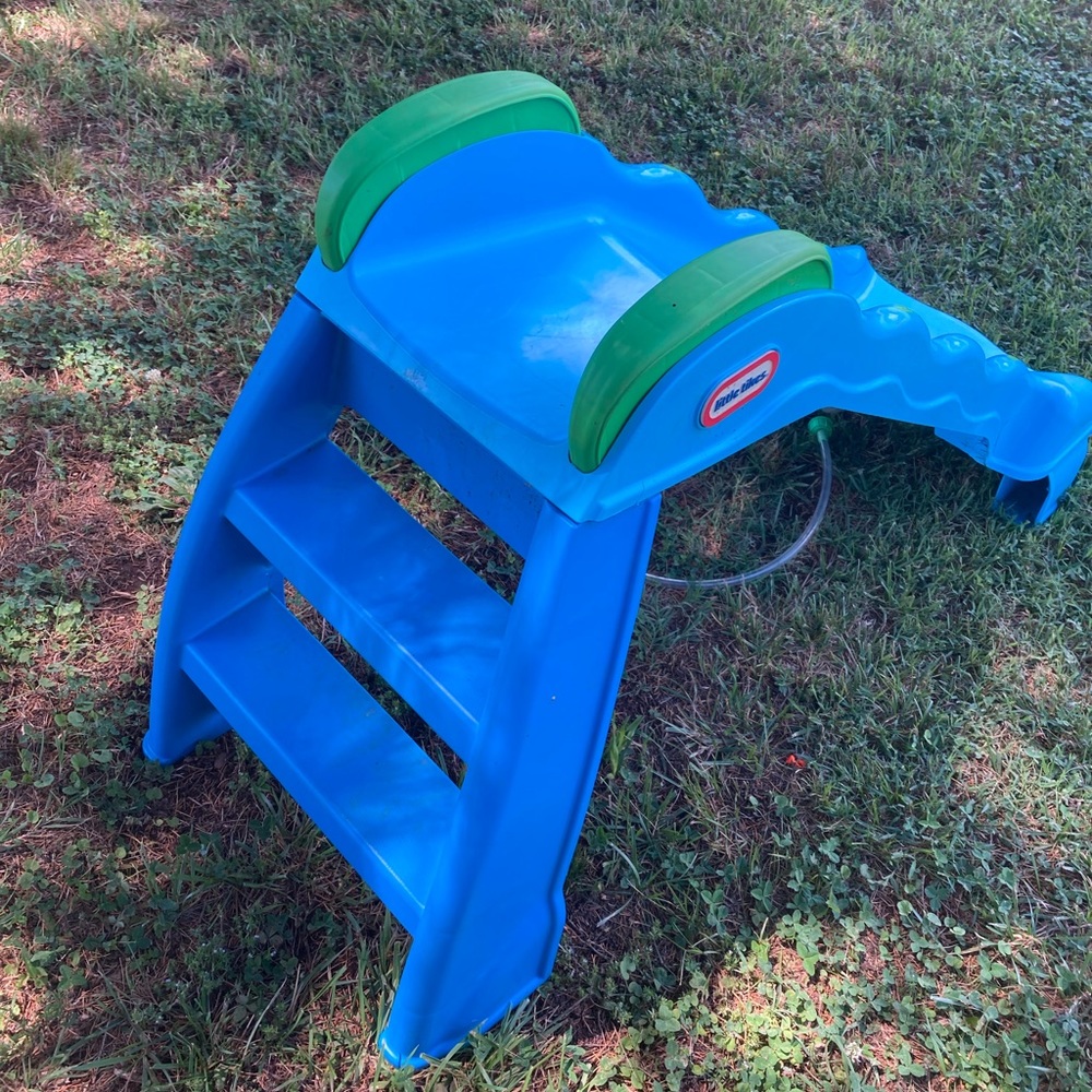 Used toddler two in one slide with sprinkler built in